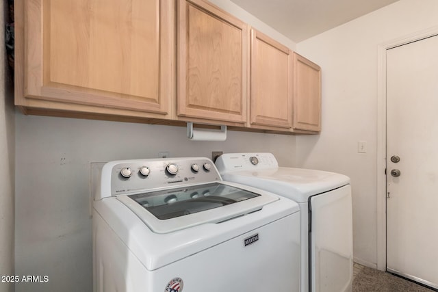 laundry room with washing machine and dryer and cabinet space