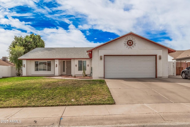 ranch-style house featuring a garage, concrete driveway, and stucco siding