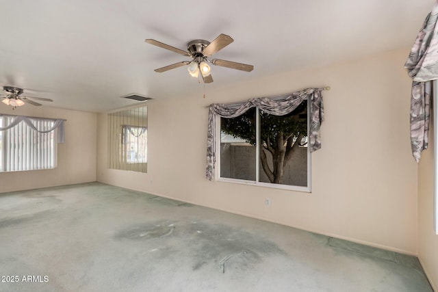unfurnished room with ceiling fan and carpet floors