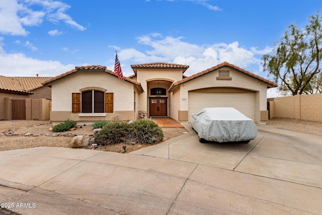 mediterranean / spanish-style house featuring a garage