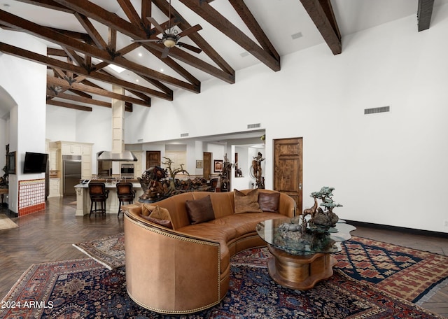 living room with beamed ceiling, ceiling fan, high vaulted ceiling, and dark parquet floors