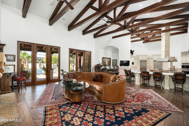 living room with high vaulted ceiling, french doors, ceiling fan, and dark parquet floors