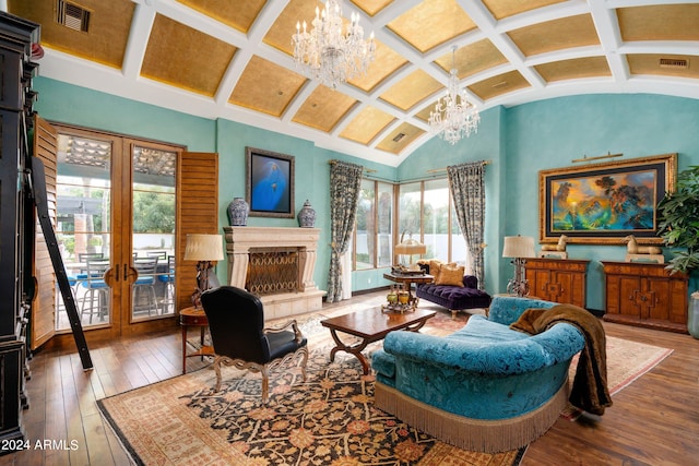 living room featuring vaulted ceiling with beams, hardwood / wood-style flooring, and coffered ceiling