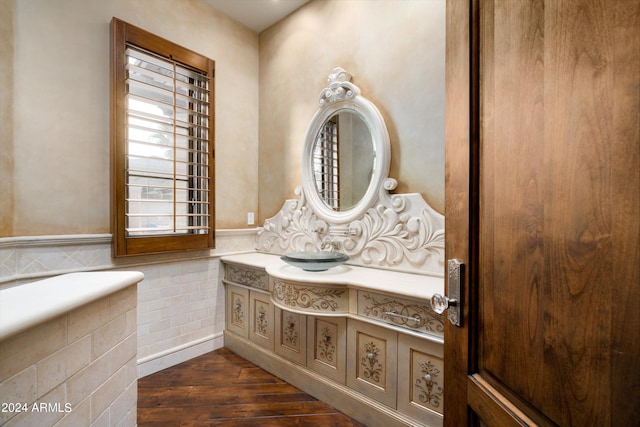 interior space featuring wood-type flooring and oversized vanity