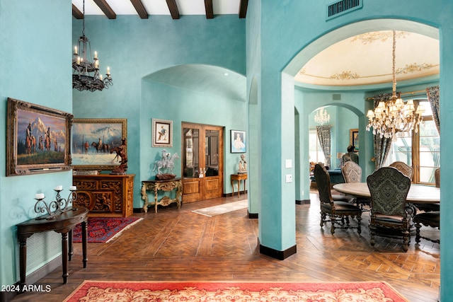 interior space featuring a notable chandelier, beam ceiling, dark parquet flooring, and a high ceiling