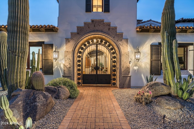 view of exterior entry featuring french doors