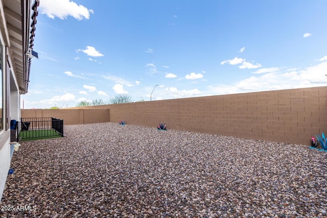 view of yard with a fenced backyard