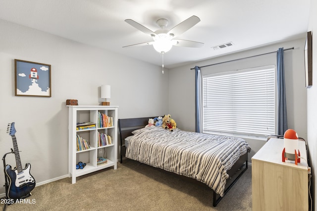 bedroom with visible vents, carpet flooring, baseboards, and a ceiling fan