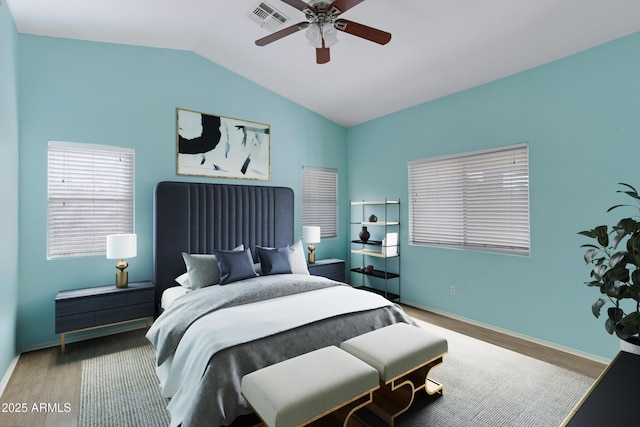 bedroom with wood-type flooring, vaulted ceiling, and ceiling fan