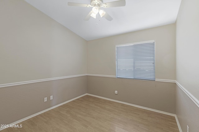 spare room with light hardwood / wood-style flooring and ceiling fan