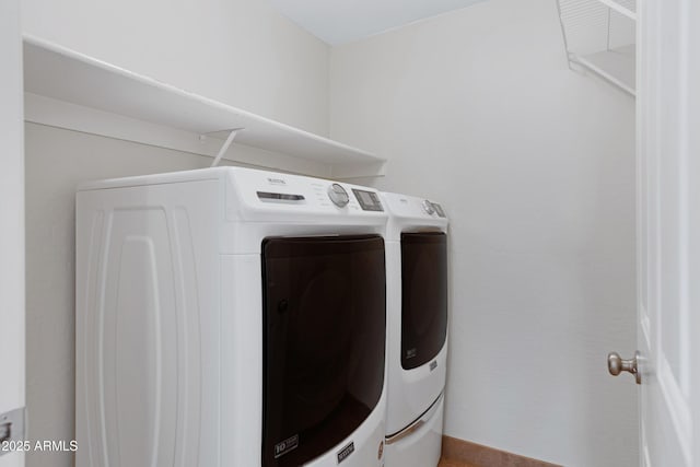 washroom with washer and dryer