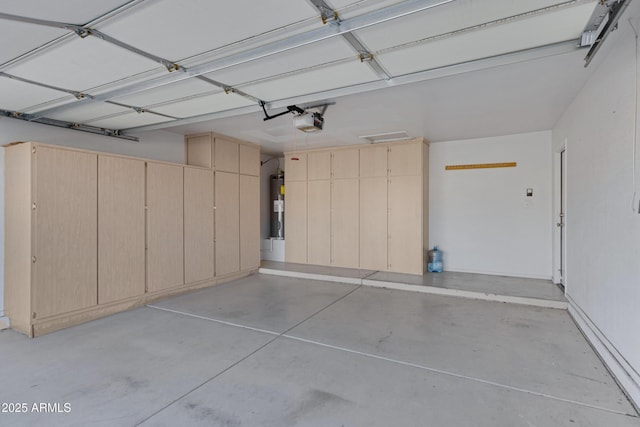 garage with a garage door opener and water heater