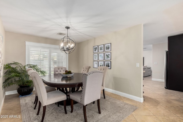 1311 W Ellis St, Mesa, AZ 85201 - dining room with a chandelier, light tile patterned floors, and baseboards