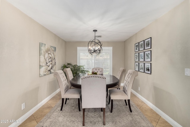 1311 W Ellis St, Mesa, AZ 85201 - dining area with light tile patterned floors, a chandelier, and baseboards