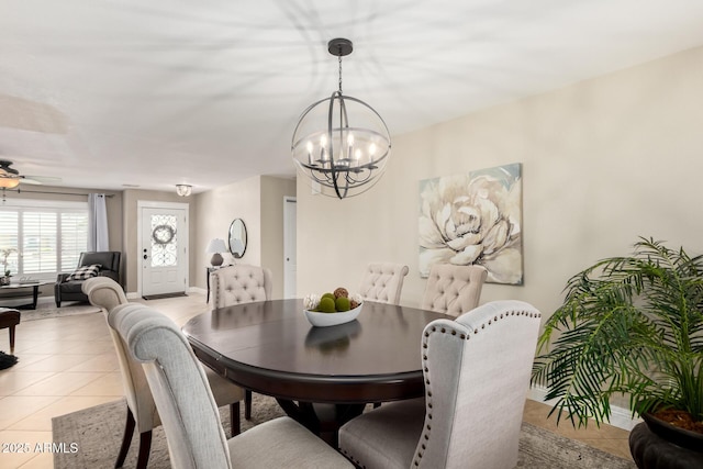 1311 W Ellis St, Mesa, AZ 85201 - dining space with light tile patterned floors, a chandelier, and baseboards