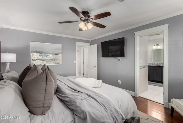1311 W Ellis St, Mesa, AZ 85201 - bedroom featuring hardwood / wood-style floors, ornamental molding, ceiling fan, and ensuite bathroom