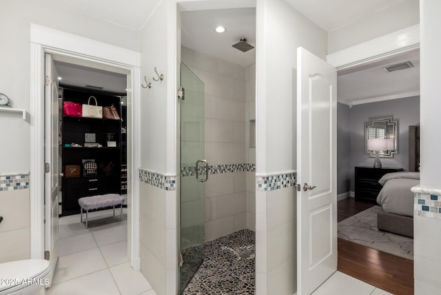 1311 W Ellis St, Mesa, AZ 85201 - bathroom with ensuite bath, a shower stall, recessed lighting, wood finished floors, and toilet