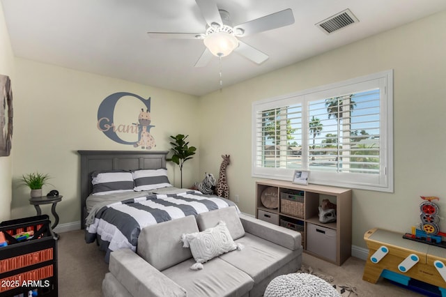 1311 W Ellis St, Mesa, AZ 85201 - carpeted bedroom with baseboards and a ceiling fan