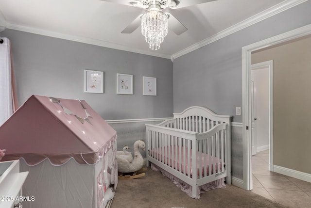 1311 W Ellis St, Mesa, AZ 85201 - tiled bedroom featuring crown molding, a crib, a ceiling fan, and baseboards