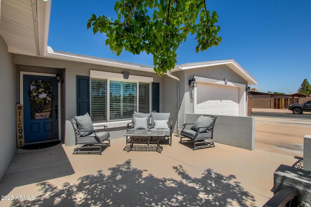 1311 W Ellis St, Mesa, AZ 85201 - view of patio / terrace featuring an outdoor hangout area, an attached garage, and driveway
