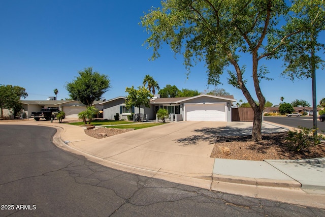 1311 W Ellis St, Mesa, AZ 85201 - ranch-style home featuring an attached garage and driveway