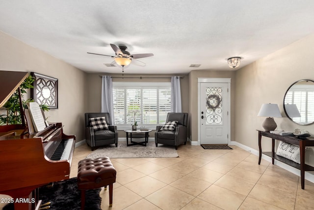 1311 W Ellis St, Mesa, AZ 85201 - foyer with healthy amount of natural light, ceiling fan, and baseboards