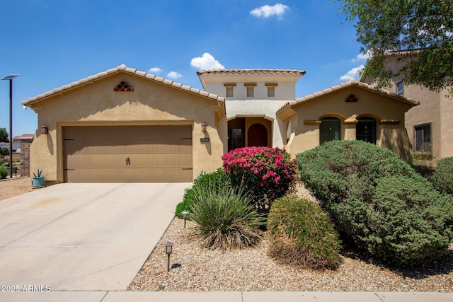 157 N 110th Ave, Avondale, AZ 85323 - mediterranean / spanish home featuring stucco siding, a garage, driveway, and a tile roof