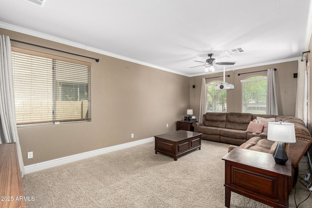 157 N 110th Ave, Avondale, AZ 85323 - living area with ceiling fan, crown molding, baseboards, and light colored carpet