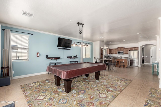 157 N 110th Ave, Avondale, AZ 85323 - rec room featuring light tile patterned floors, crown molding, arched walkways, pool table, and baseboards