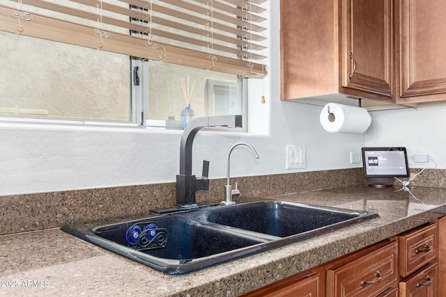 157 N 110th Ave, Avondale, AZ 85323 - kitchen with a sink, brown cabinets, and dark countertops