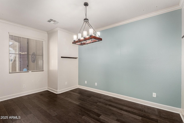157 N 110th Ave, Avondale, AZ 85323 - spare room featuring dark wood-type flooring, crown molding, a chandelier, and baseboards