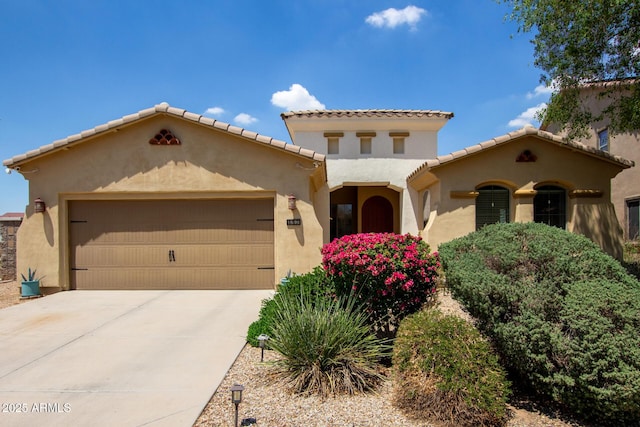157 N 110th Ave, Avondale, AZ 85323 - mediterranean / spanish house with stucco siding, an attached garage, driveway, and a tile roof