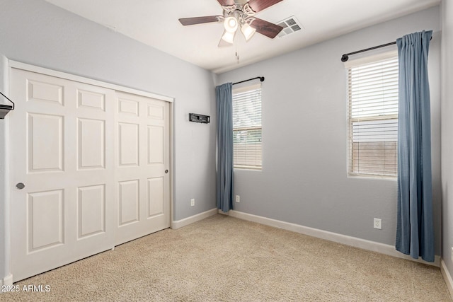 157 N 110th Ave, Avondale, AZ 85323 - unfurnished bedroom featuring carpet flooring, baseboards, a closet, and ceiling fan