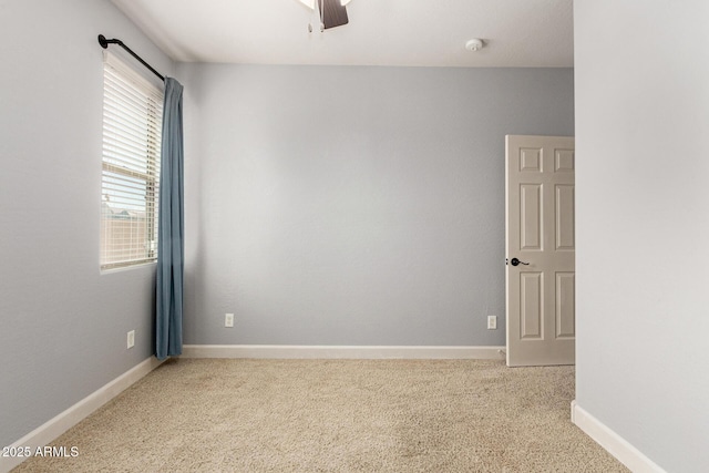 157 N 110th Ave, Avondale, AZ 85323 - carpeted spare room featuring a smoke detector, baseboards, and ceiling fan