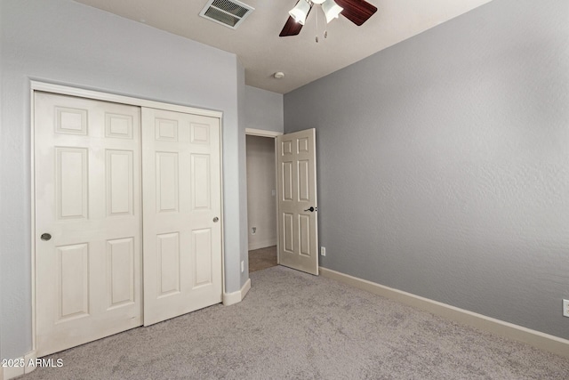 157 N 110th Ave, Avondale, AZ 85323 - unfurnished bedroom with carpet, a closet, baseboards, and a ceiling fan