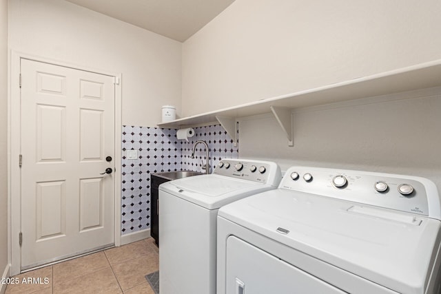 157 N 110th Ave, Avondale, AZ 85323 - washroom with independent washer and dryer, light tile patterned flooring, and baseboards