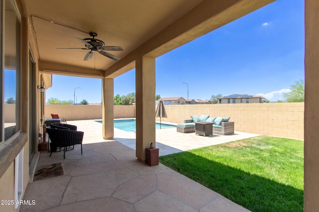 157 N 110th Ave, Avondale, AZ 85323 - fenced backyard featuring outdoor lounge area, a patio area, and a ceiling fan