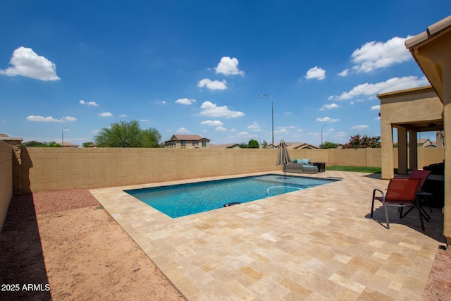 157 N 110th Ave, Avondale, AZ 85323 - view of swimming pool featuring a patio area and a fenced backyard
