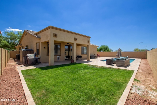 157 N 110th Ave, Avondale, AZ 85323 - back of property featuring stucco siding, ceiling fan, a patio, and a tile roof