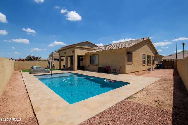 157 N 110th Ave, Avondale, AZ 85323 - view of swimming pool featuring a fenced backyard, a patio, and an outdoor hangout area