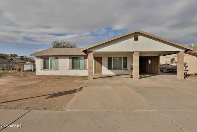 back of property with a carport