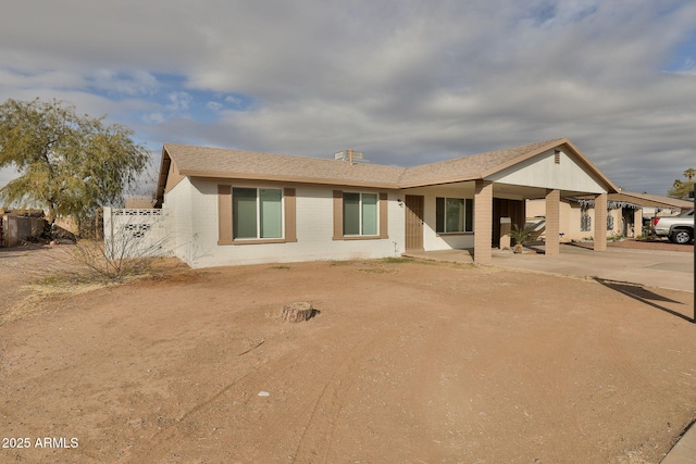 rear view of house with a carport