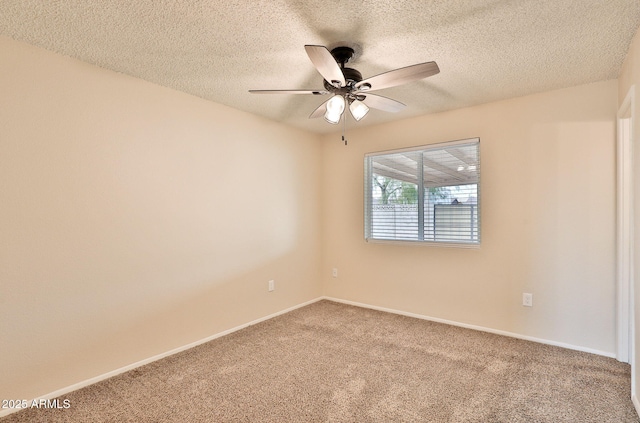 carpeted empty room featuring a textured ceiling and ceiling fan