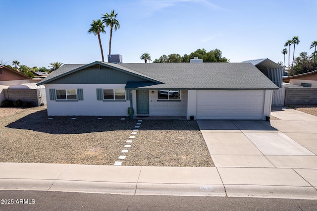 ranch-style home featuring a shingled roof, central AC, fence, a garage, and driveway