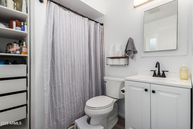 full bath featuring toilet, a shower with curtain, and vanity