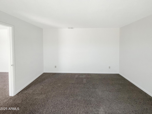 15650 N 19th Ave Unit 1206, Phoenix, AZ 85023 - unfurnished room featuring dark carpet and baseboards