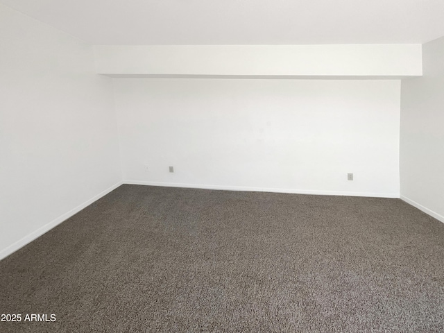 15650 N 19th Ave Unit 1206, Phoenix, AZ 85023 - spare room featuring dark carpet and baseboards