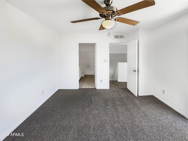 15650 N 19th Ave Unit 1206, Phoenix, AZ 85023 - unfurnished bedroom featuring carpet floors, baseboards, ensuite bathroom, and a ceiling fan