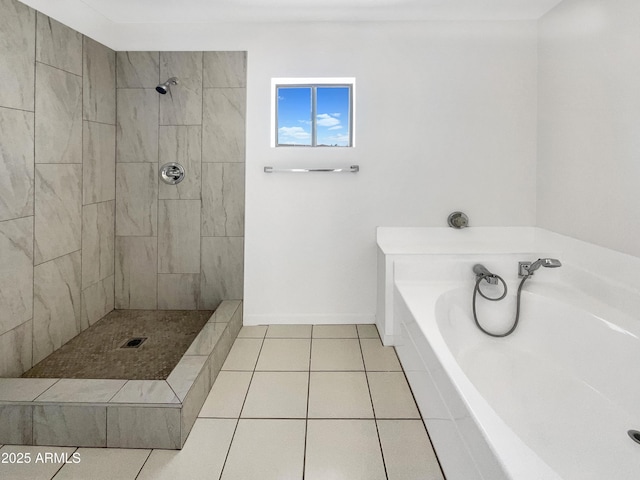 15650 N 19th Ave Unit 1206, Phoenix, AZ 85023 - bathroom with tile patterned flooring, a garden tub, tiled shower, and baseboards