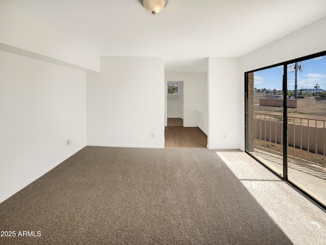 15650 N 19th Ave Unit 1206, Phoenix, AZ 85023 - carpeted empty room featuring baseboards